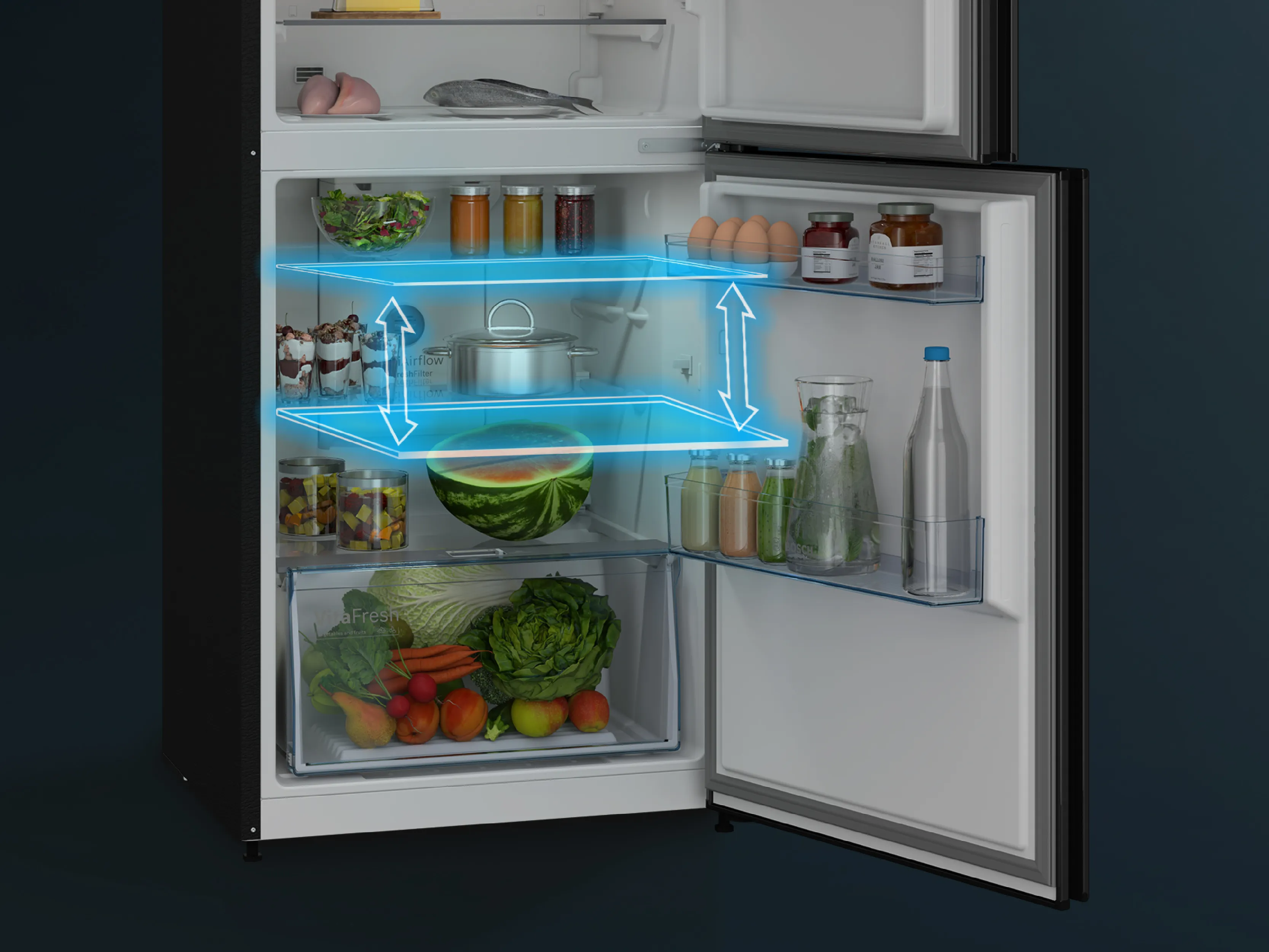 A modern refrigerator with a stainless steel finish, showcasing neatly organized food items and fresh produce inside.
