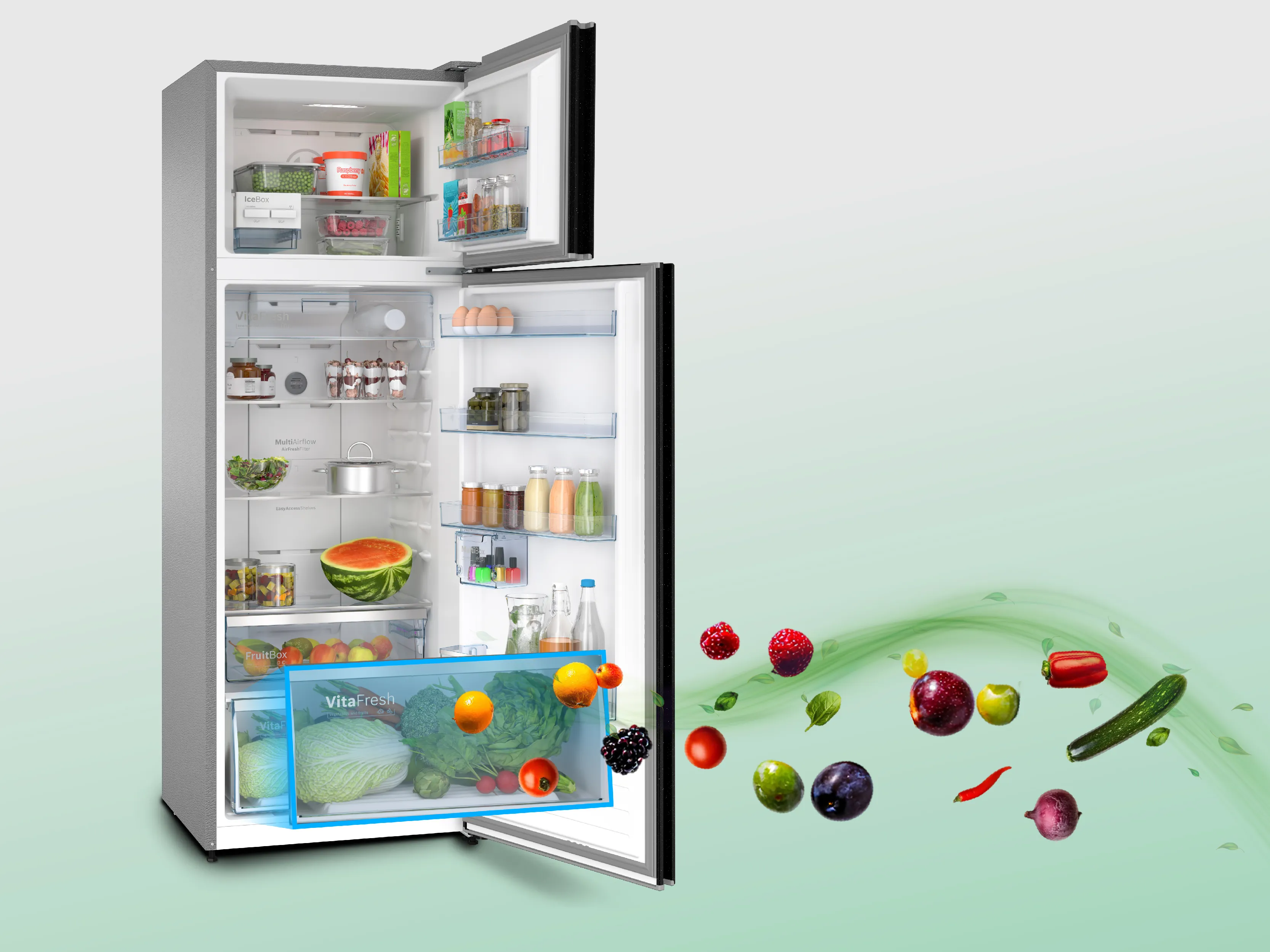 A view inside a refrigerator showcasing fresh fruits and vegetables in organized drawers, along with fish on a plate above.