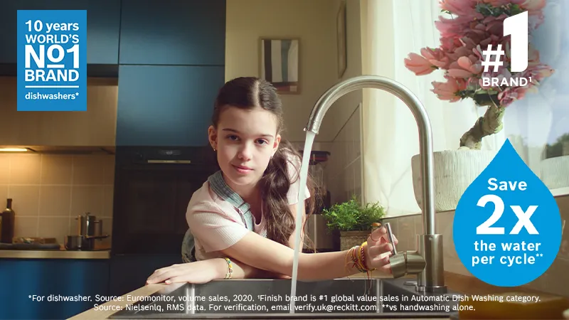 Girl running kitchen tap showing water saved message