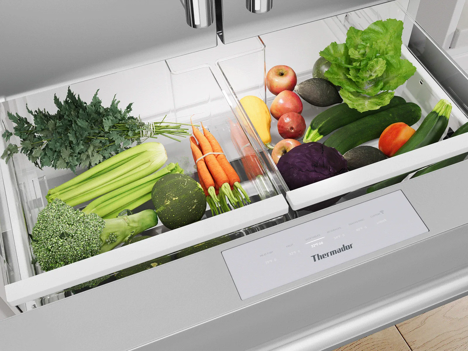 A Thermador refrigerator crisper drawer filled with a variety of fresh vegetables.