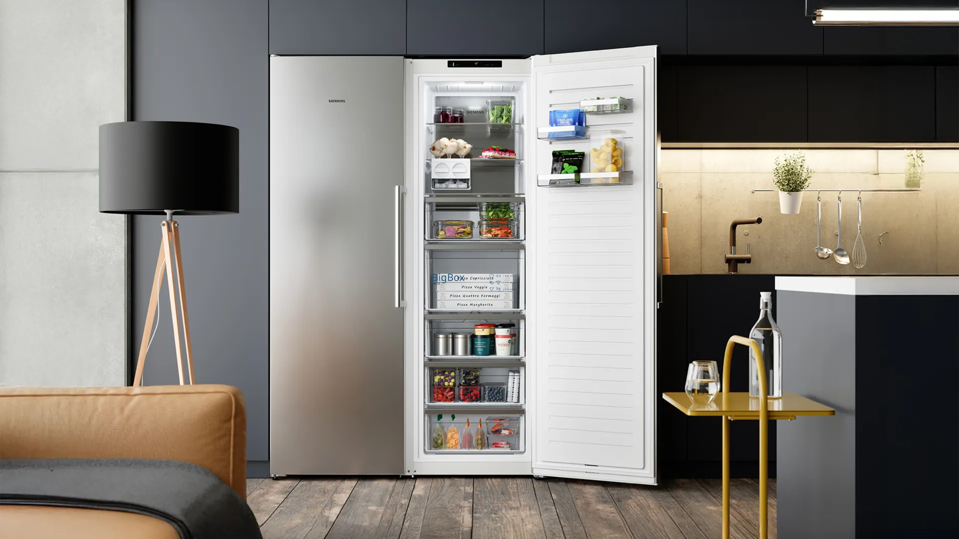 Modern kitchen with an open Siemens freezer filled with various foods, next to a leather sofa, black floor lamp, and yellow table with water bottle.