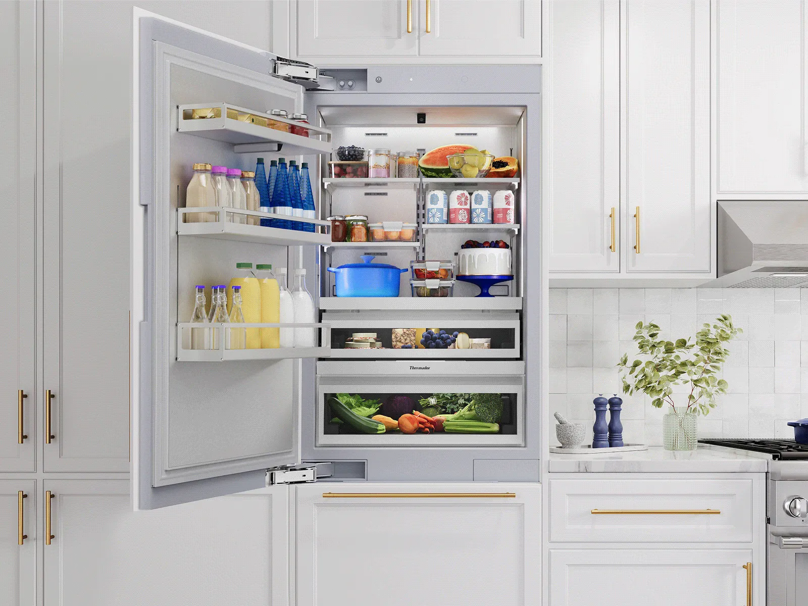 A single-door built-in refrigerator open to show a stocked interior in a white kitchen.