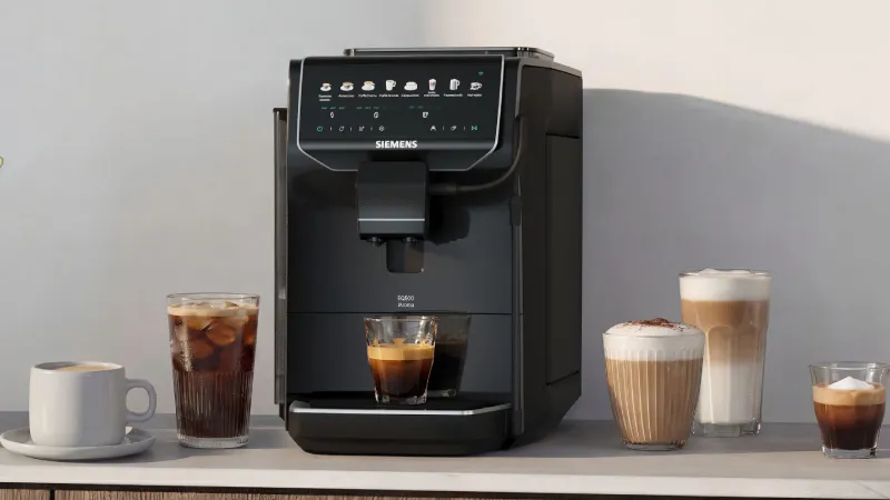 Siemens EQ500 iAroma automatic coffee machine brewing an espresso on a kitchen counter.
