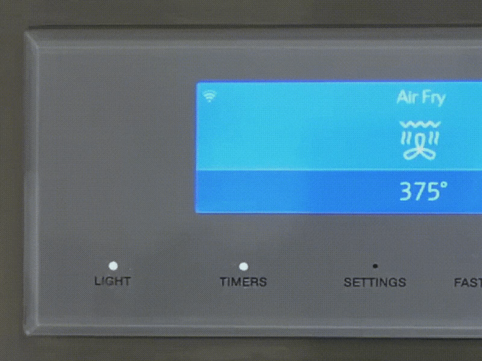 Oven control panel showing Air Fry mode at 375 degrees, with buttons for light, timers, and settings.