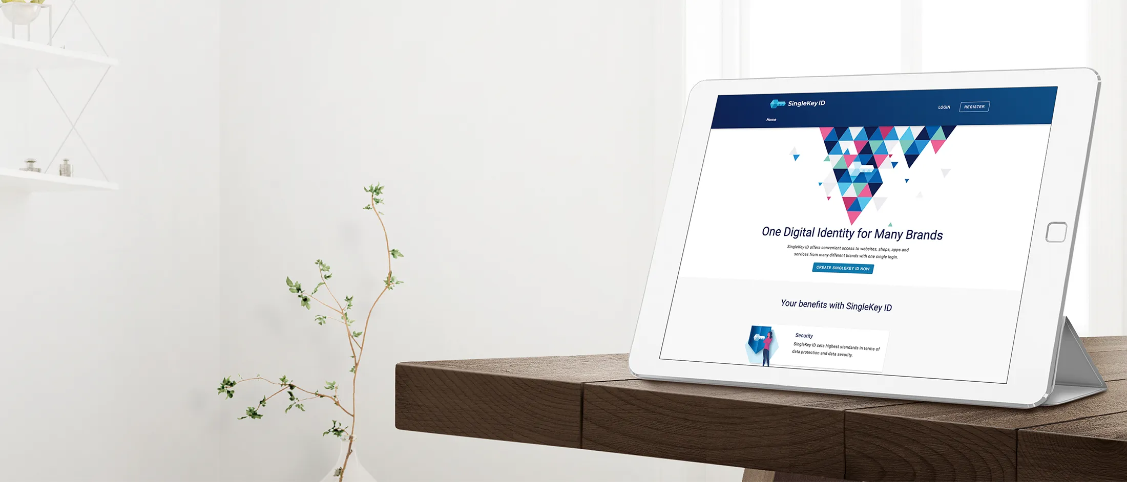 Tablet on wooden table displaying SingleKey ID website with digital identity branding in a bright, minimalist room.
