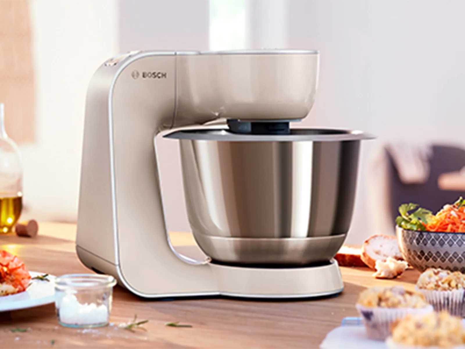 Kitchen appliance, food preparation, mixing bowl, salad, baked goods, cooking utensils, countertop.