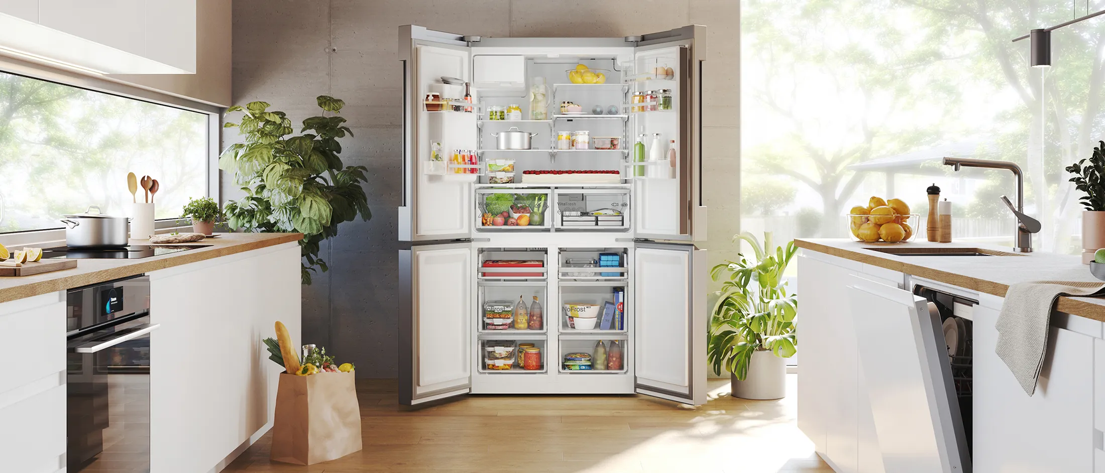Cucina moderna con frigorifero aperto, piante e luce naturale.