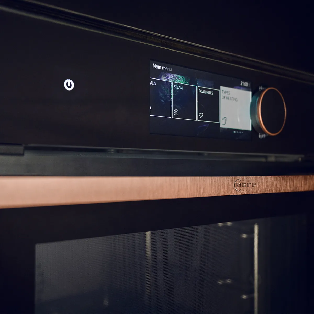 A finger taps the digital display of a Neff oven, showing "Circo-roasting" mode set to 200°C.