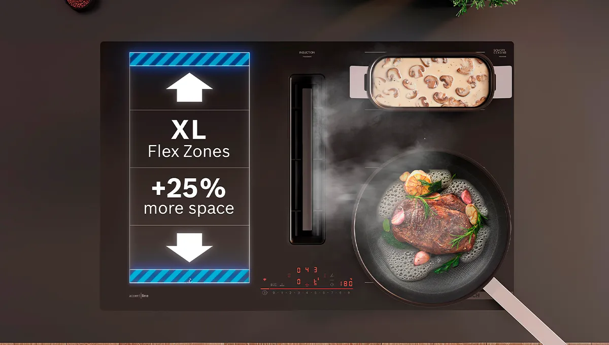 Encimera de inducción Bosch con extractor integrado, cocinando un filete y champiñones. Cuenta con zonas XL Flex para un 25% más de espacio.
