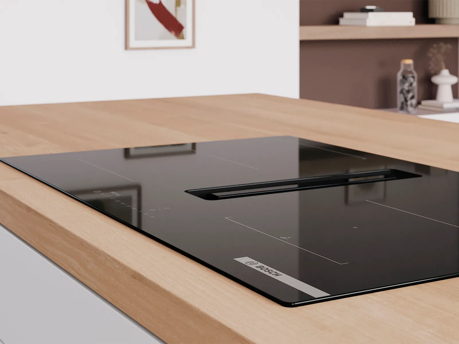 Encimera de inducción Bosch negra con ventilación integrada, instalada sobre una cubierta de cocina de madera clara.
