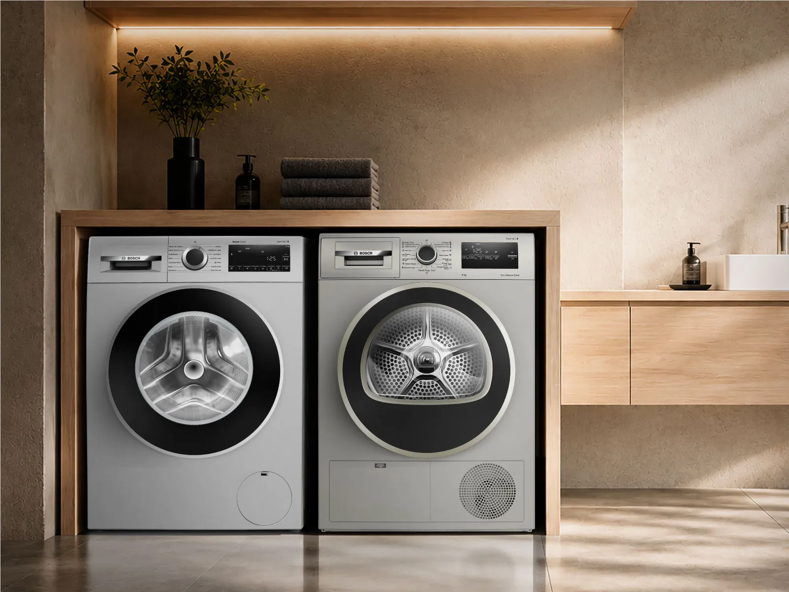 A laundry room featuring a clothing rack with hanging shirts, a pair of white washer and dryer.