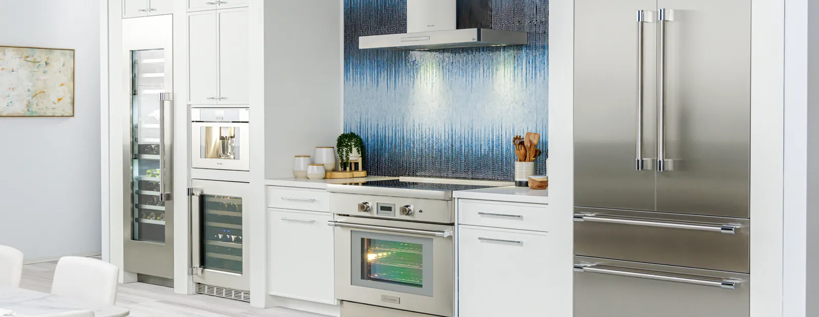 Shot of Thermador contemporary kitchen with white cabinets and various Thermador appliances