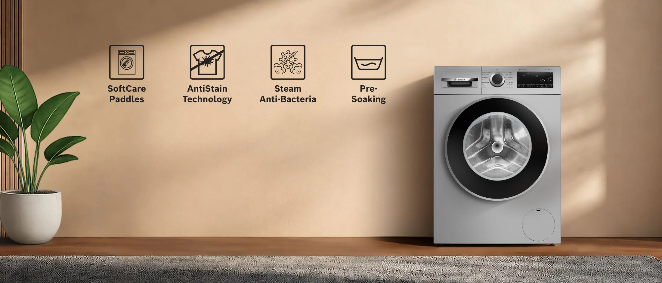 Bosch freestanding washer next to condense dryer in a modern laundry room.