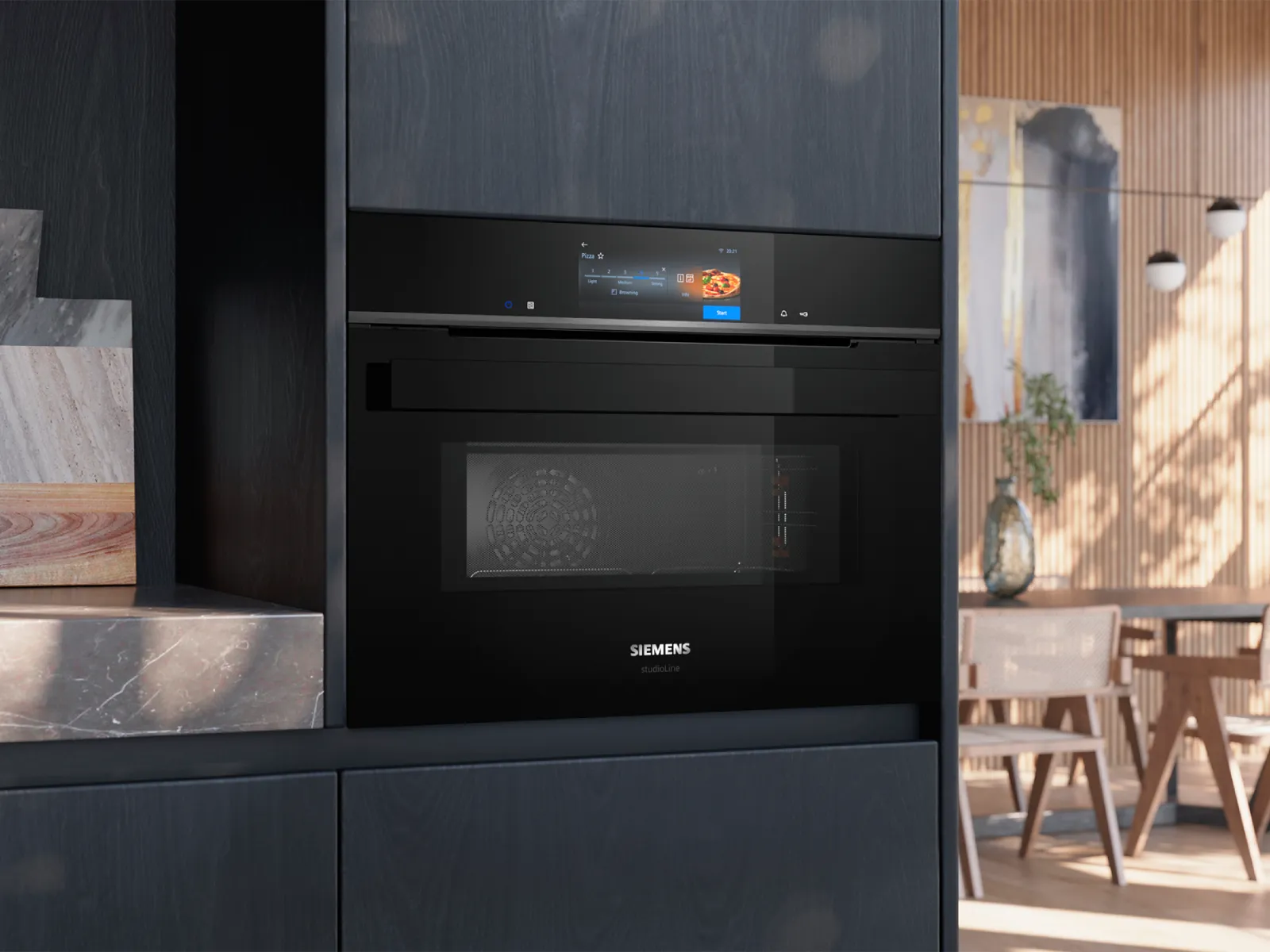 Black Siemens studioLine oven with digital display showing pizza settings in a modern kitchen.