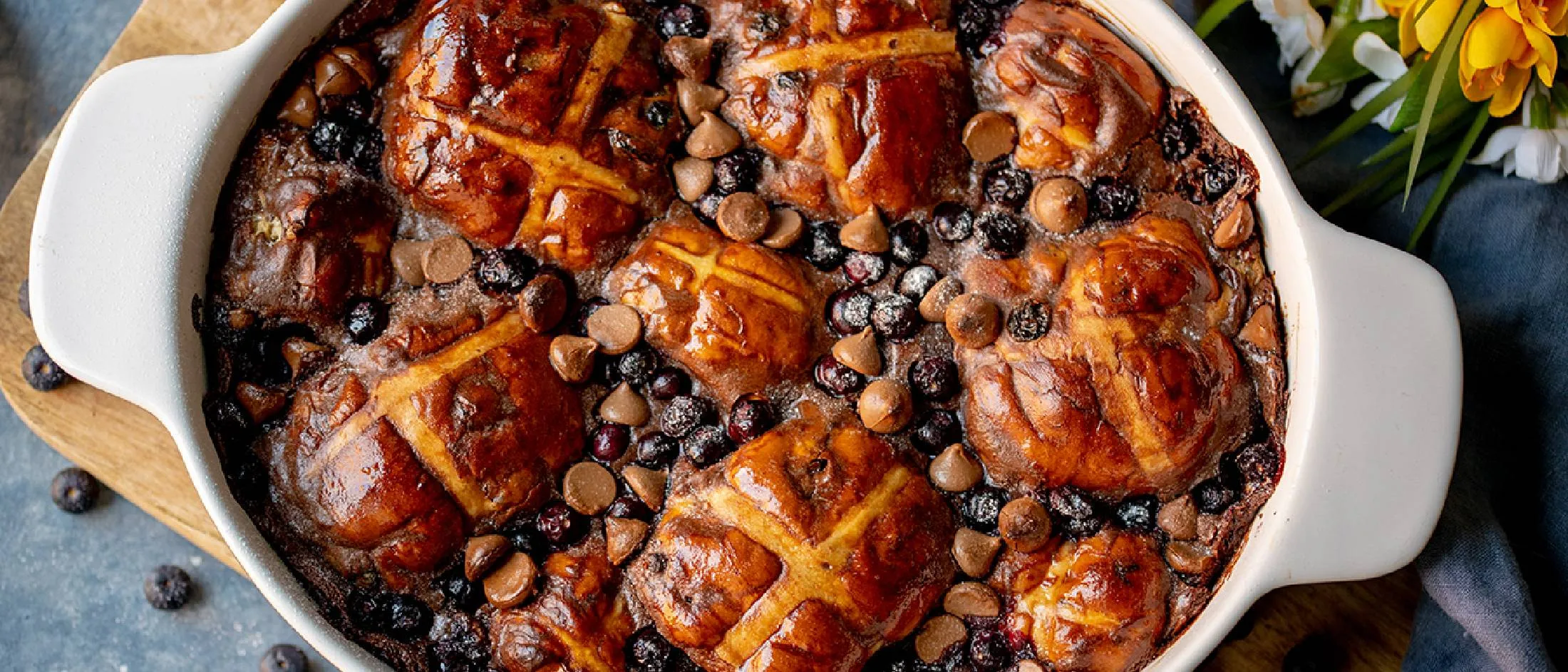 Baked casserole dish with hot cross buns and other ingredients.