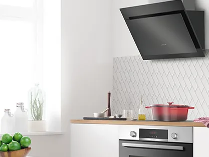 An open modern Bosch oven with a digital display showing a steam cooking function.