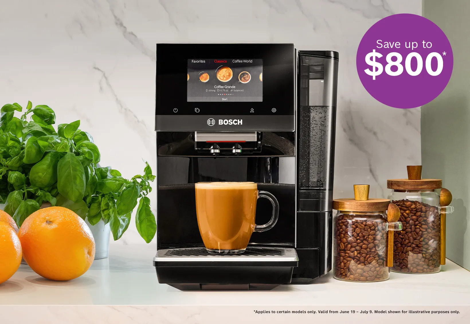 Bosch coffee machine brewing a latte with oranges, basil plant, and jars of coffee beans on a kitchen counter.