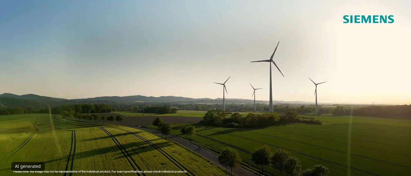 Vindkraftverk reser sig högt över gröna fält under en klar himmel, med Siemens-logotypen i det övre högra hörnet.
