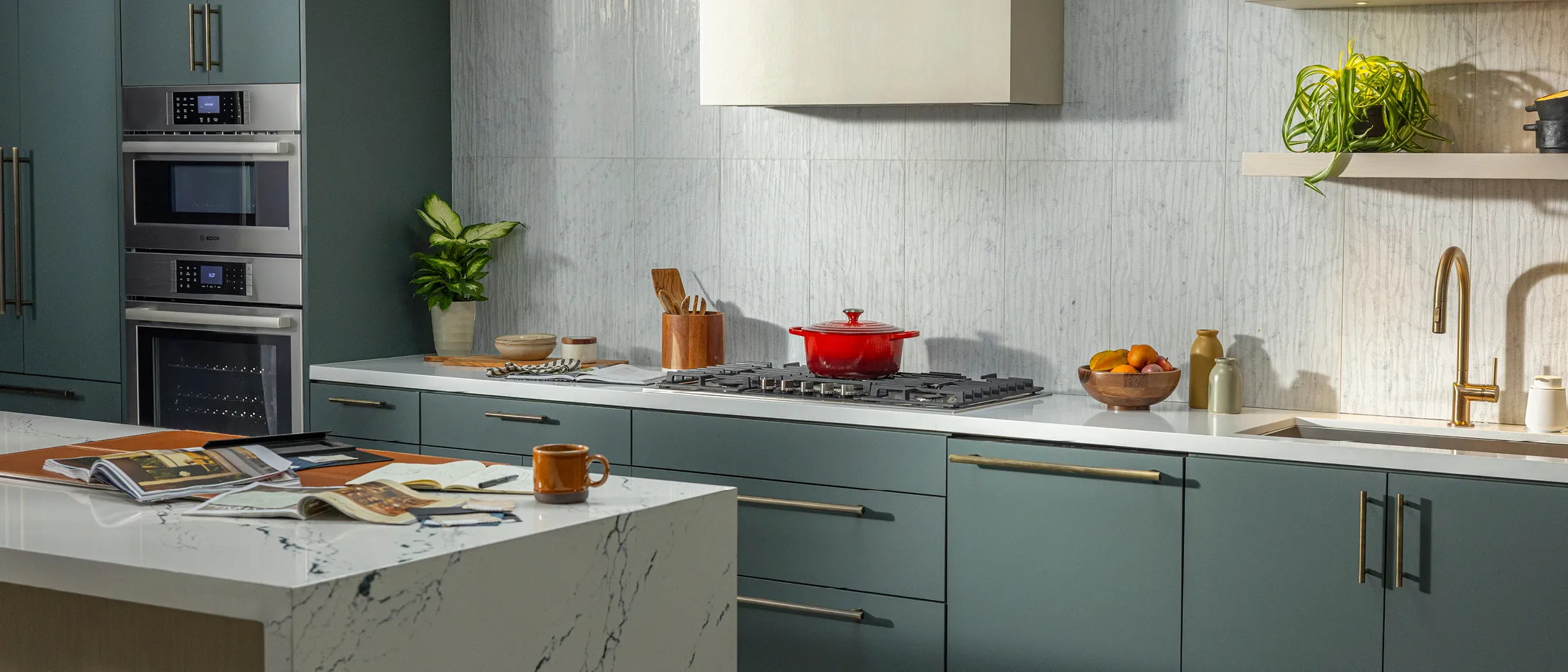 Bosch appliance is hero kitchen shot with aqua blue cabinetry