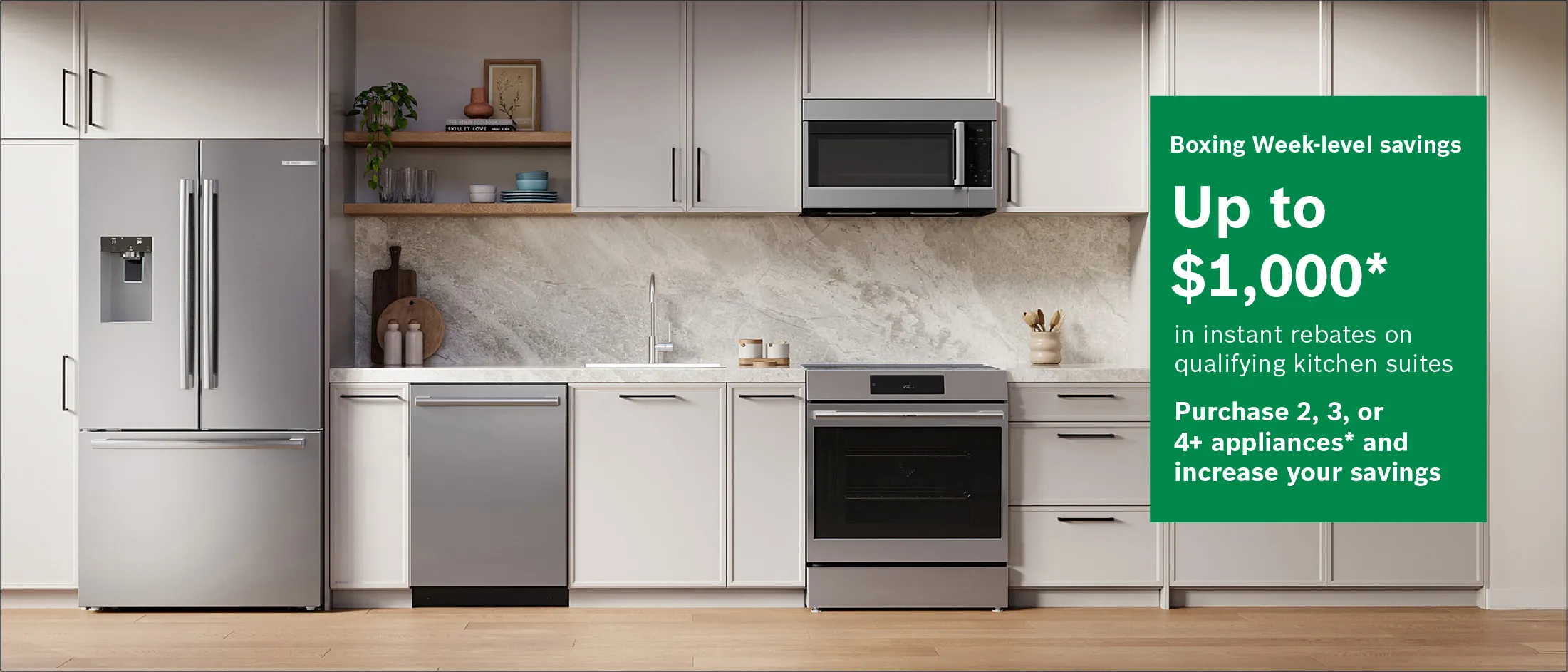 Modern kitchen with stainless steel refrigerator, dishwasher, oven, microwave, and white cabinetry, featuring Boxing Week savings up to $1,000.