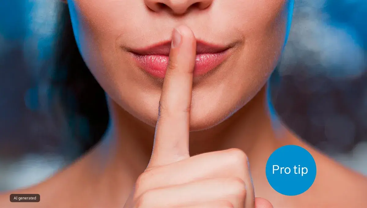 Lower half of woman's face with a finger to her mouth to represent quiet