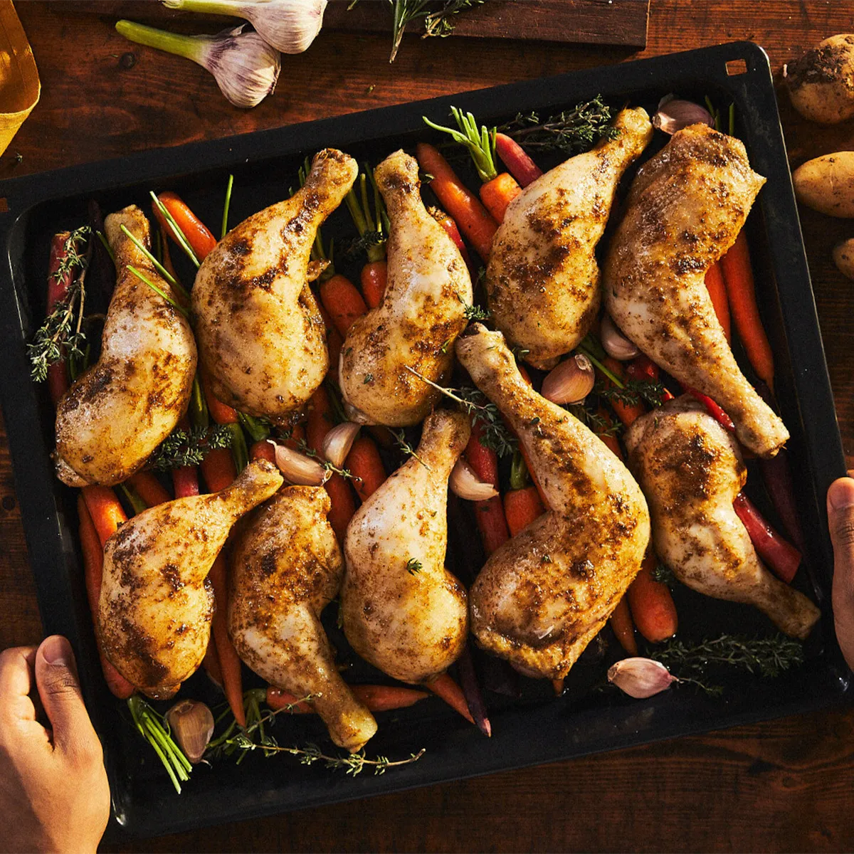 Roasting cajun chicken thighs and carrots under the grill