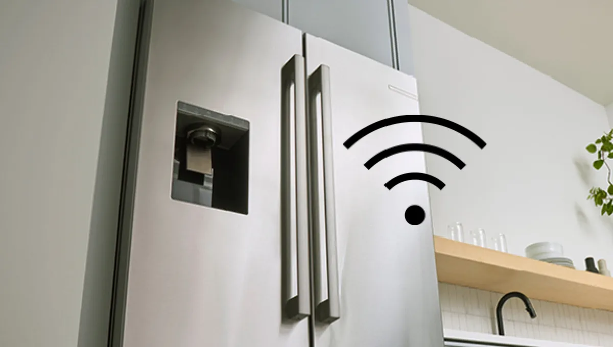 Modern stainless steel smart refrigerator with double doors and built-in water dispenser in a sleek kitchen setting.