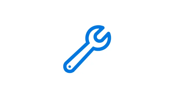 Icono de llave inglesa azul que representa herramientas, reparación o mantenimiento.