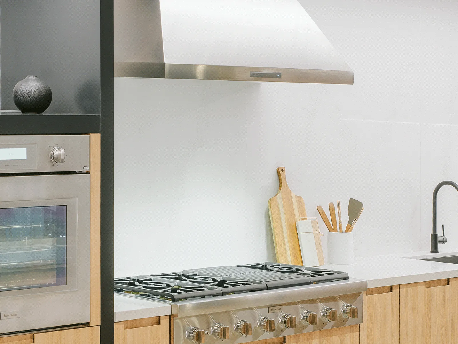 Thermador HPCN48WS professional pyramid chimney hood as a kitchen focal point.