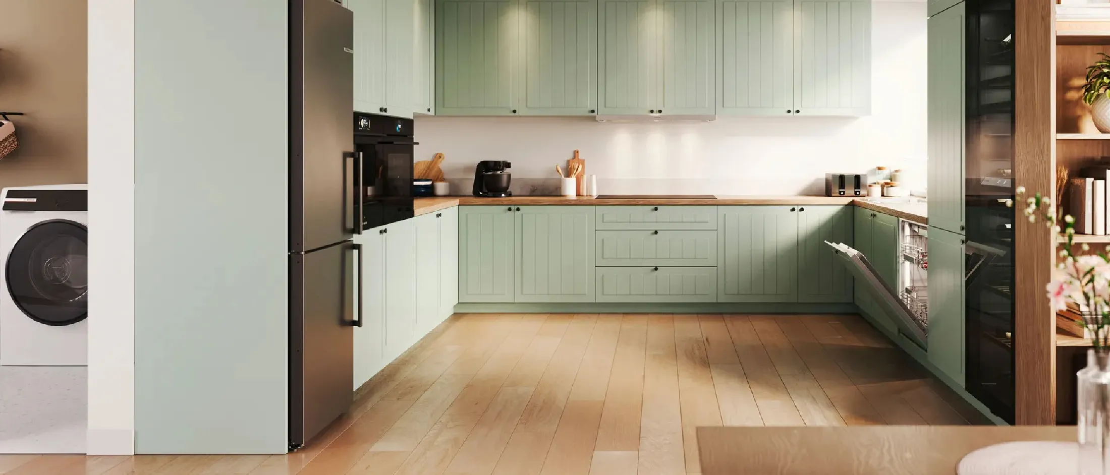 Bilden visar ett grönt Ikea-inspirerat kök med Bosch vitvaror.