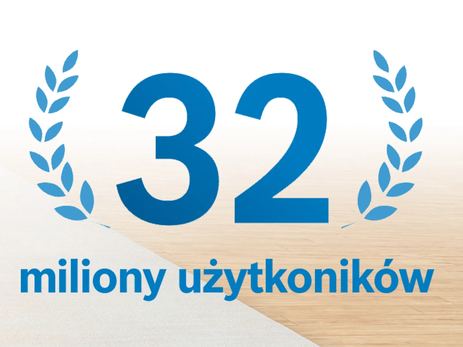Wieniec rocznicowy z napisem "32 miliony użytkowników" na jasnym tle.
