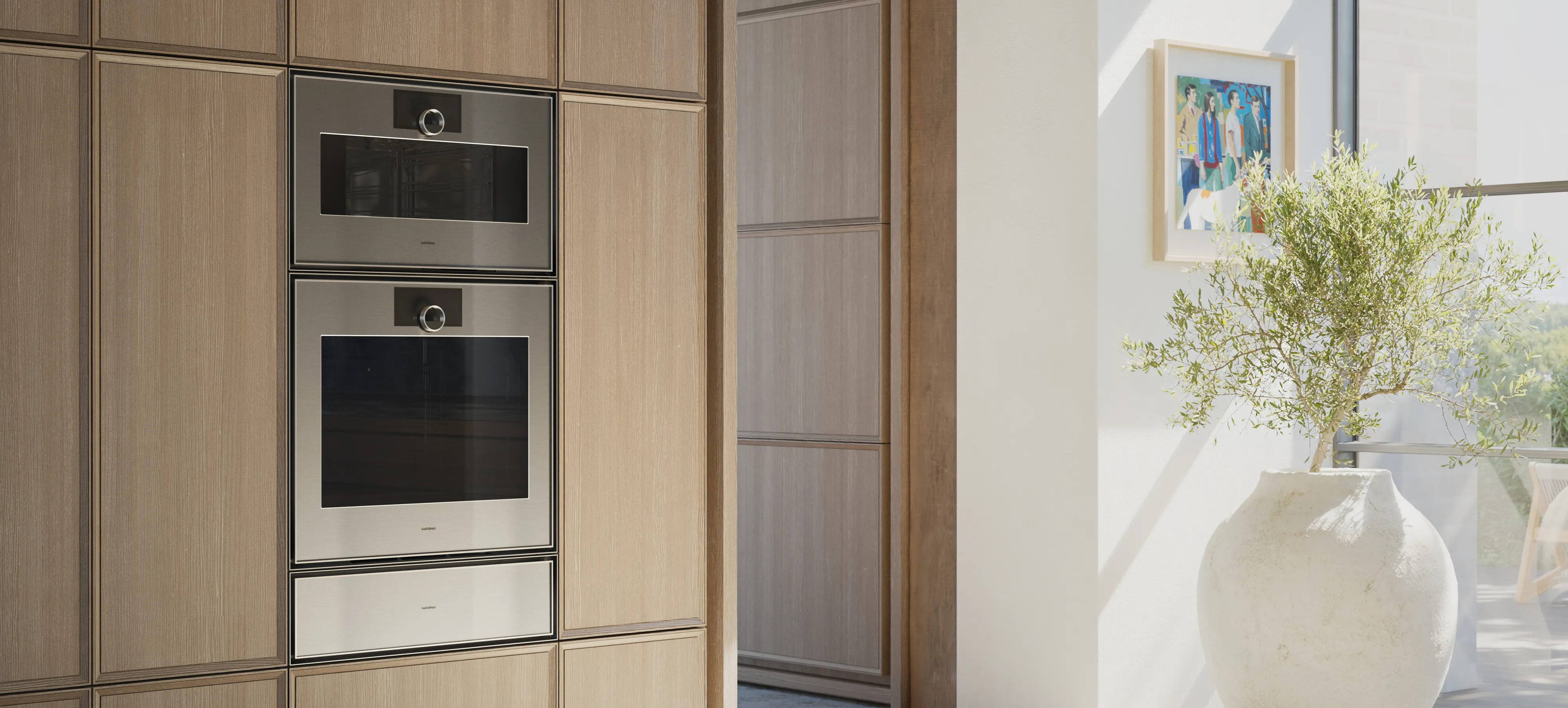 View into an open plan luxury kitchen fitted with Gaggenau Expressive series appliances