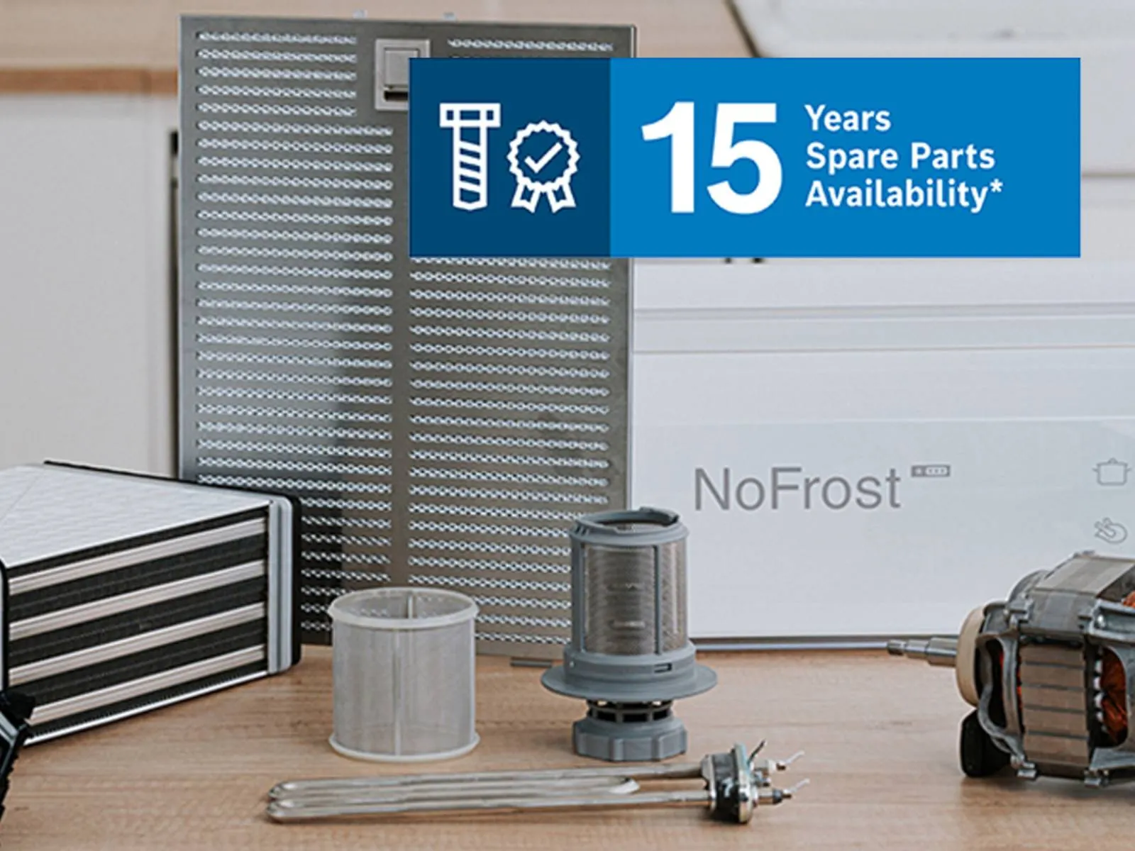 Different tools and spare parts on worktop with 15 Years Spare Parts icon