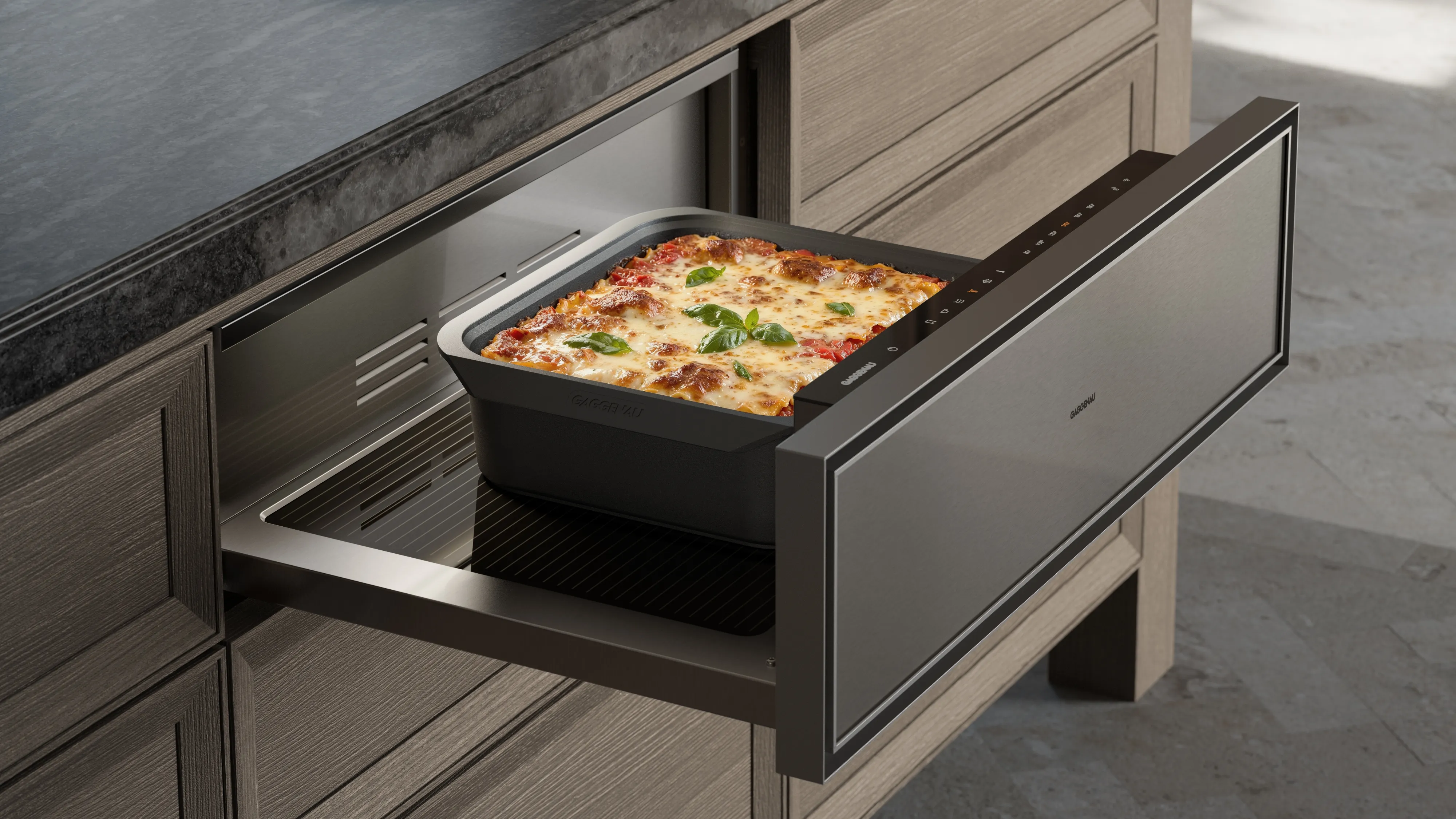 View of an open Gaggenau culinary warming drawer heating food
