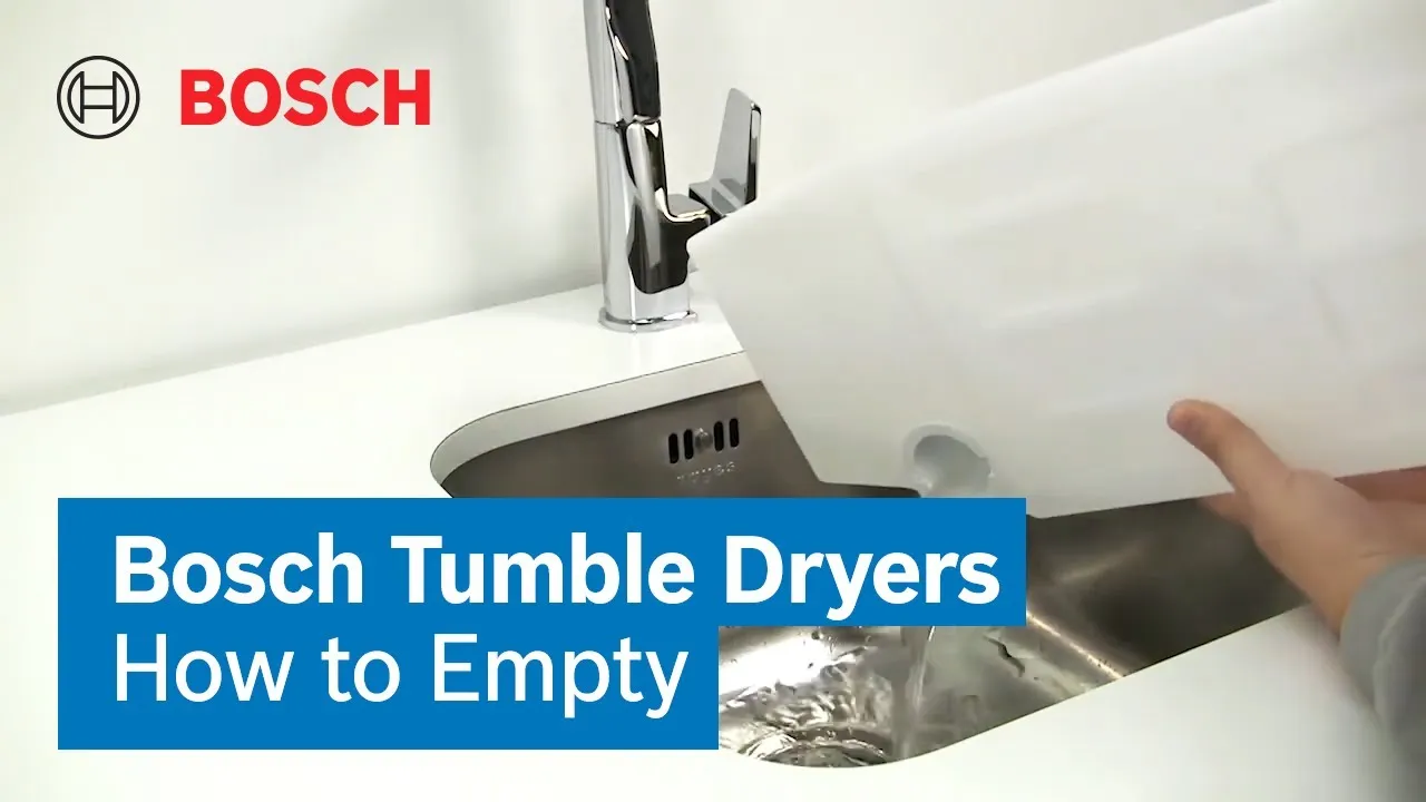 A person hand emptying the tumble dryer container to the sink.