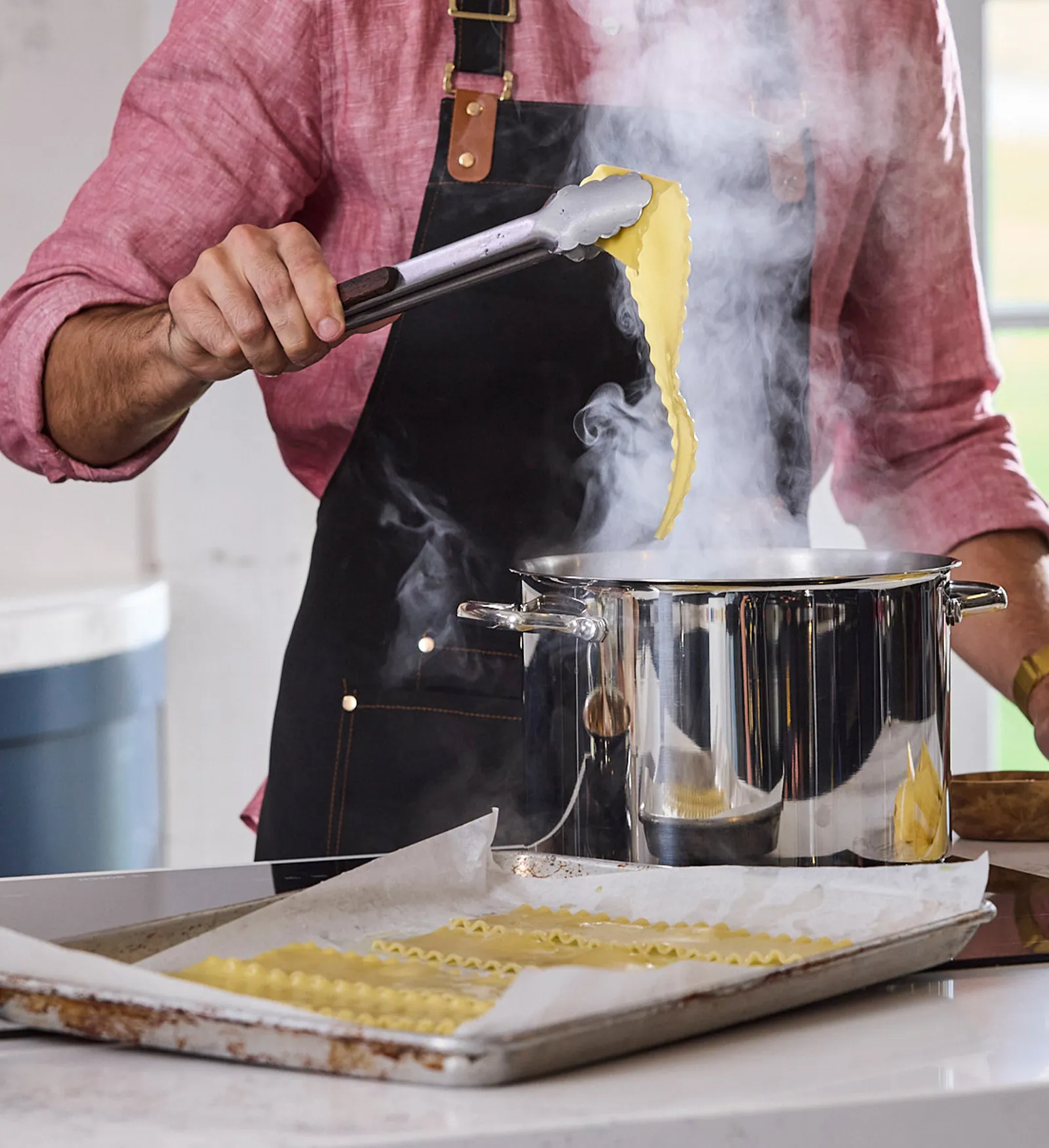 Chef cooking lasagna sheets