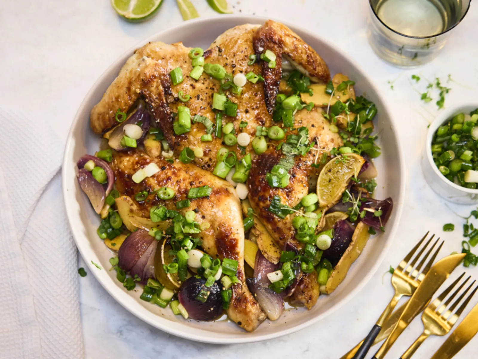 Tender chicken served in a bowl with ginger and spring onions.