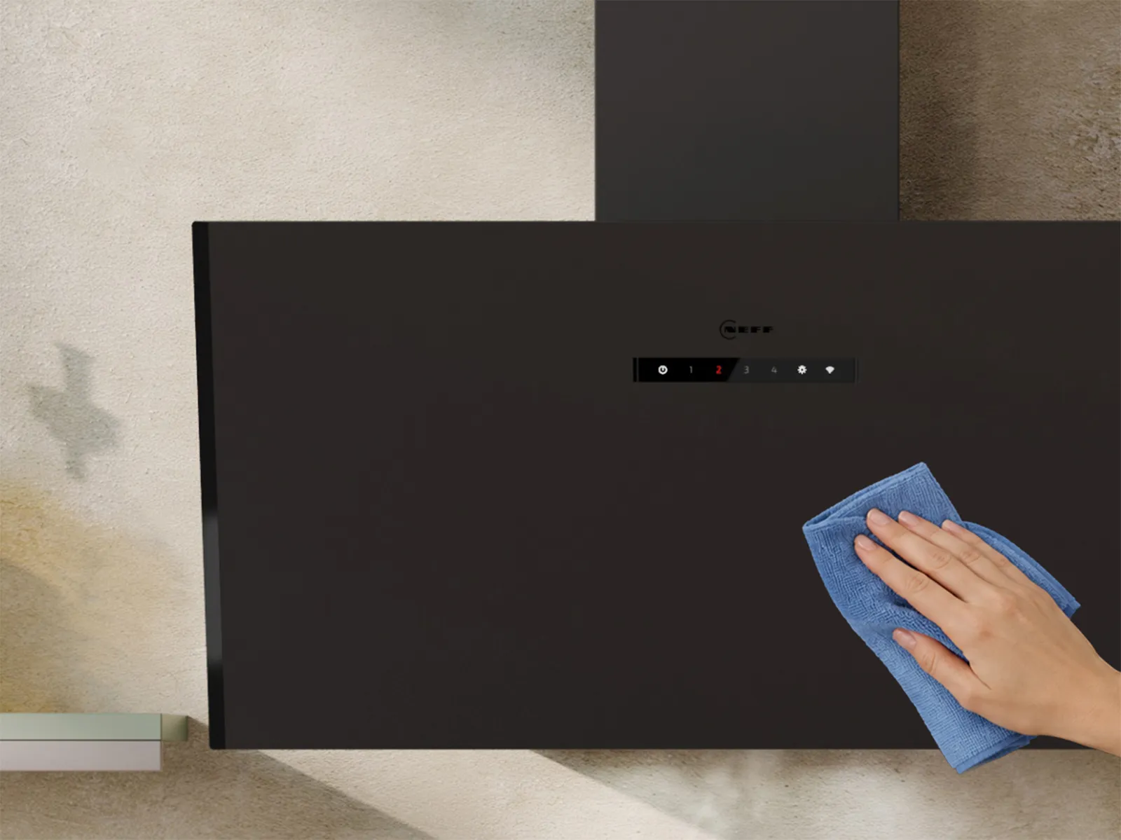 Black modern kitchen exhaust hood with digital control panel mounted on a beige textured wall between two shelves.