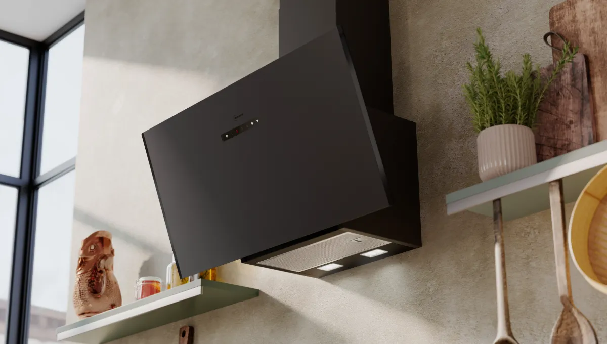 Angled black Neff kitchen hood with illuminated controls, mounted on a textured wall in a modern kitchen setting.