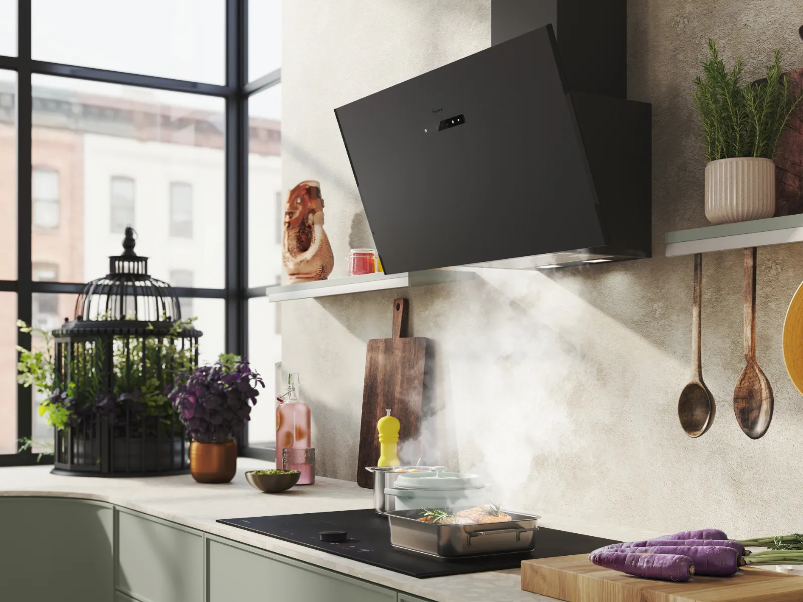 Modern kitchen with black range hood, stovetop cooking with steam, green cabinets, large window, and utensils on shelves.