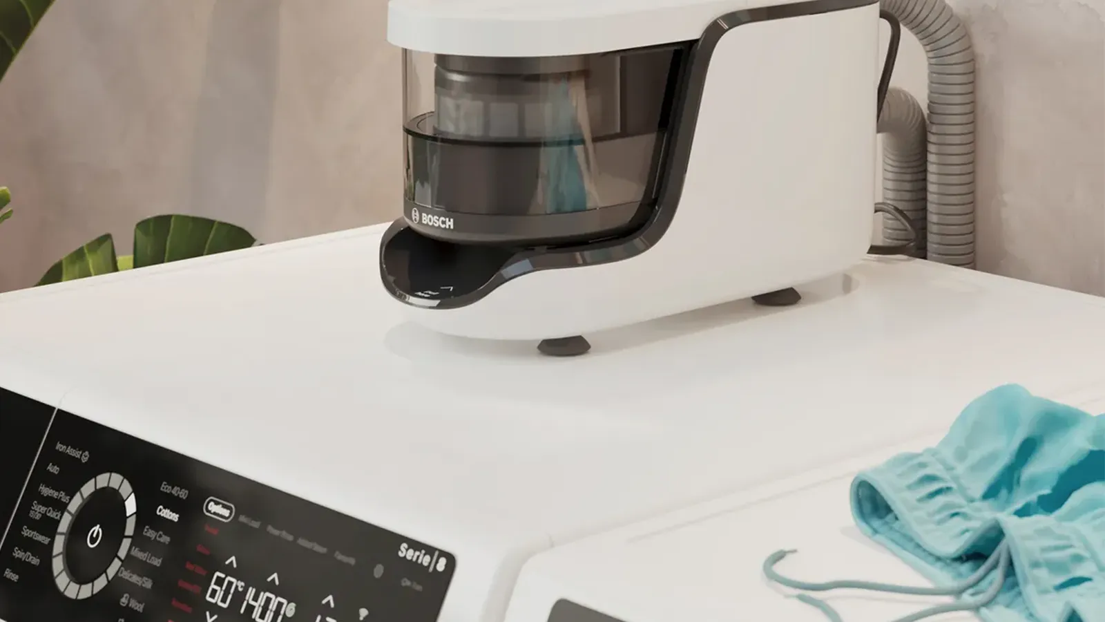 Kompaktes weißes Zubehörgerät oder Mikrofaserfilter von Bosch auf der Oberseite einer Bosch Serie 8 Waschmaschine.