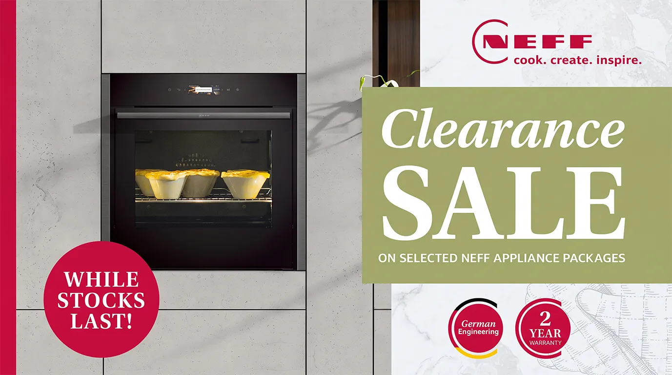 An advertisement for a NEFF Clearance Sale, featuring a black built-in oven with four golden-crusted pies baking inside, set into a light grey, concrete-textured wall. The oven's digital display shows "180°C". A red circular badge on the bottom left reads "WHILE STOCKS LAST!". On the right, a large green banner announces "Clearance SALE ON SELECTED NEFF APPLIANCE PACKAGES". Above it is the red NEFF logo with the tagline "cook. create. inspire.". Below the green banner are two red circular badges: one for "German Engineering" and another for "2 YEAR WARRANTY".