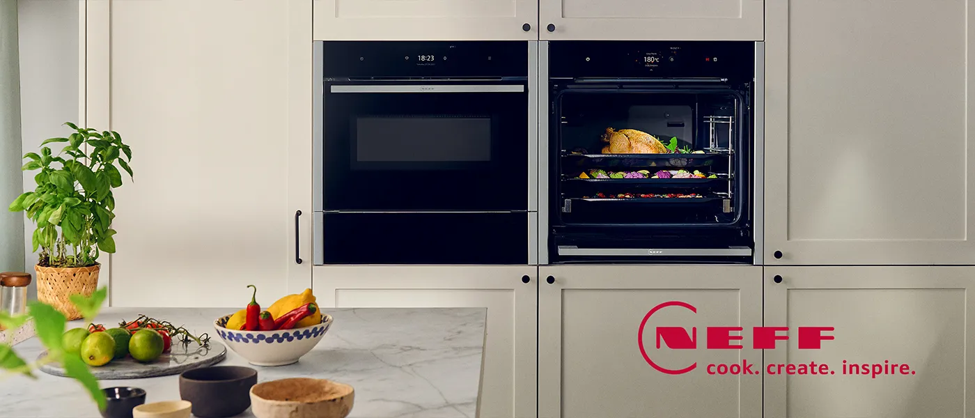 Two N90 ovens in Stainless Steel next to each other in a cream shaker style kitchen