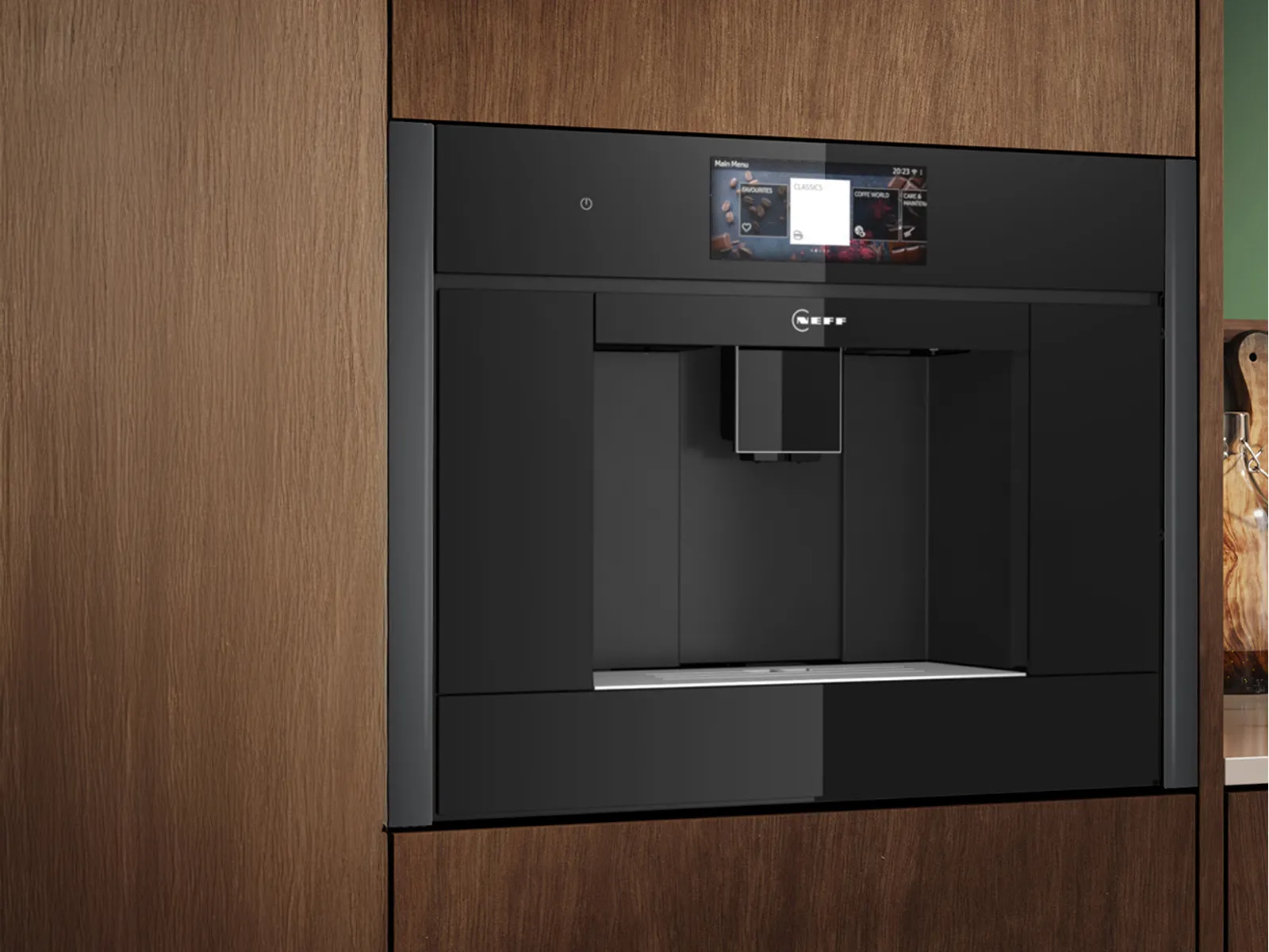Built-in black Neff coffee machine integrated into a wooden kitchen cabinet with a digital touchscreen display.