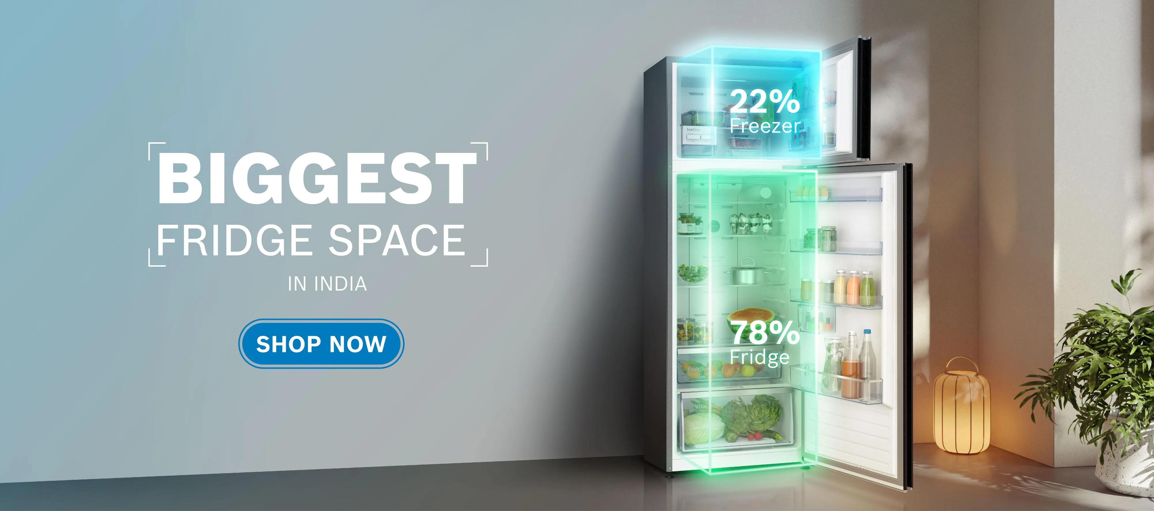 A refrigerator with its doors open, highlighting the freezer (22%) and fridge (78%) space with glowing blue and green outlines, alongside text promoting "Biggest Fridge Space in India" and a "Shop Now" button.