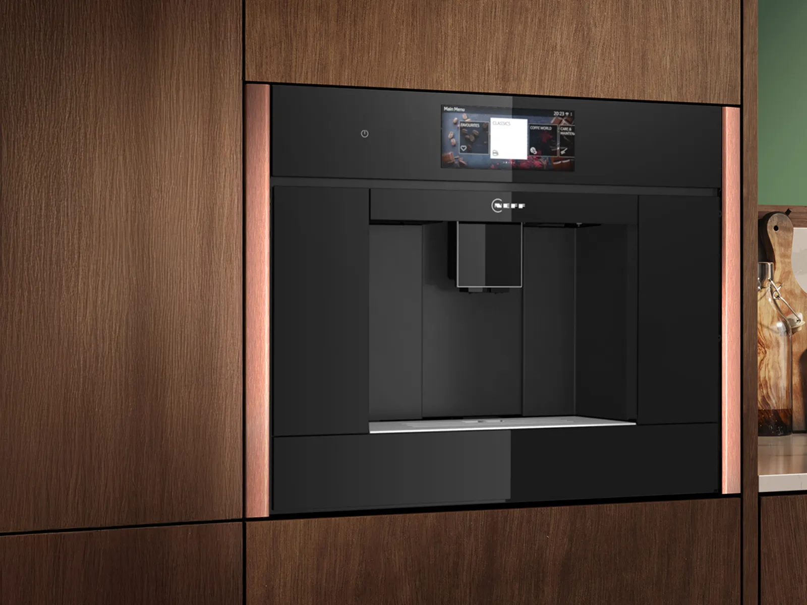 A black NEFF built-in coffee machine with brushed bronze trim, set in a modern wooden kitchen cabinet.