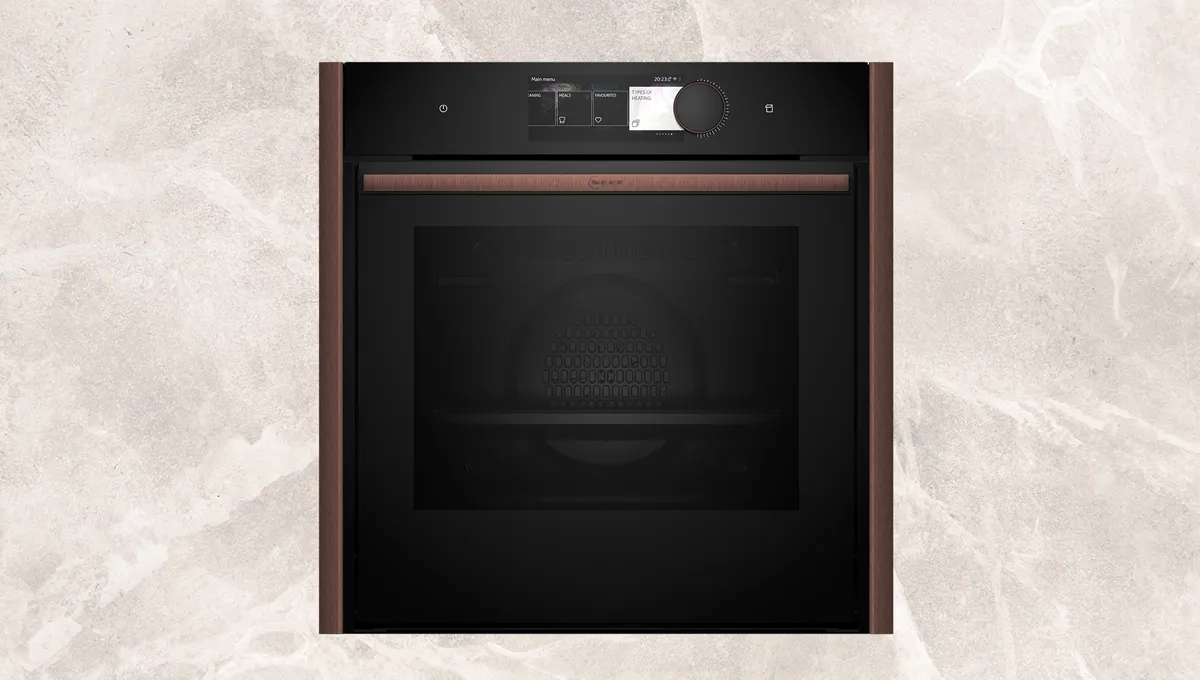 Black built-in oven with digital display and control panel.