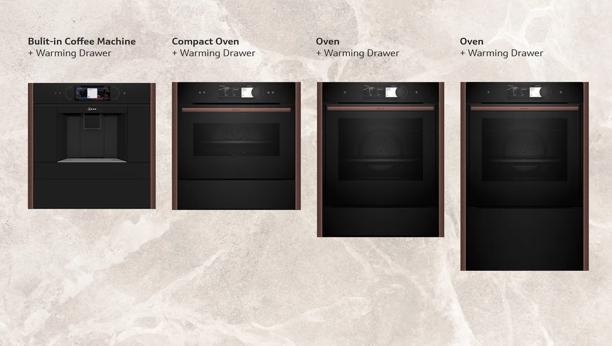 Four built-in kitchen appliances against a marble background: coffee machine, compact oven, and two ovens, all with warming drawers.