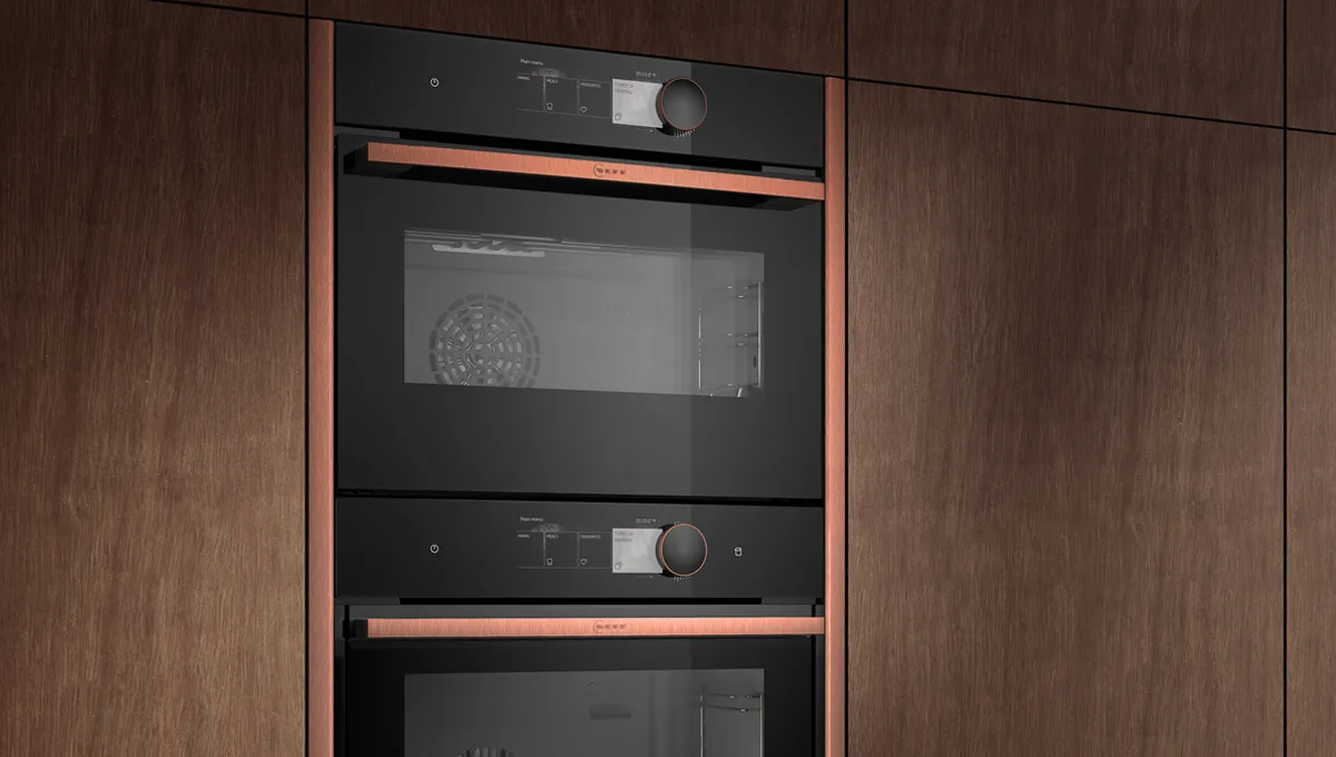 Wooden kitchen cabinets with built-in oven and microwave appliances.