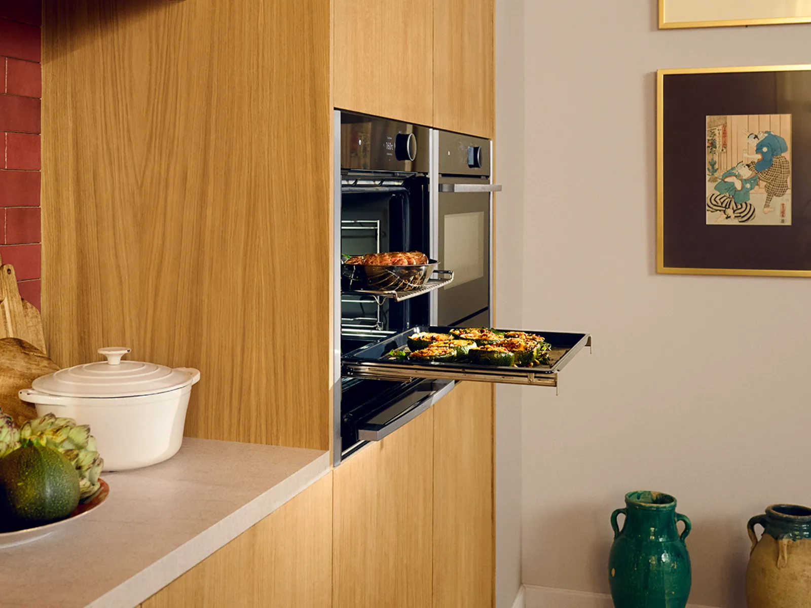 Cozy kitchen with wooden cabinets, oven, and various cooking ingredients on the counter.